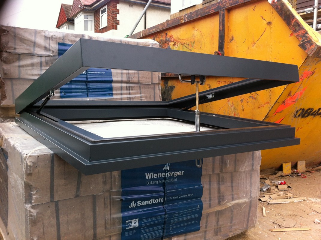 Opening flat roof skylight in anthracite grey installed in Hemel Hempstead